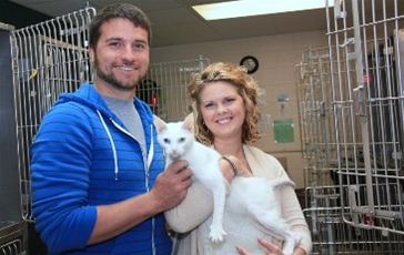 Couple with white cat