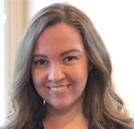 Bio photo of Sarah Collica, smiling in an indoor setting