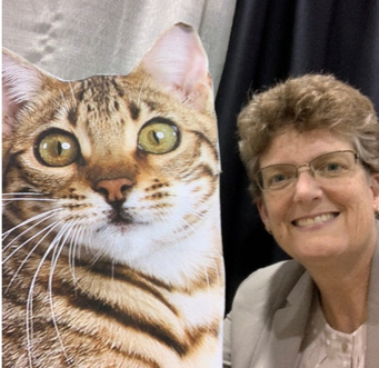 Bio photo of Dr. Jody Gookin, smiling with a striped cat in the foreground