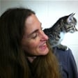 Bio photo of Dr. Sandra Newbury, smiling with a kitten on her left shoulder